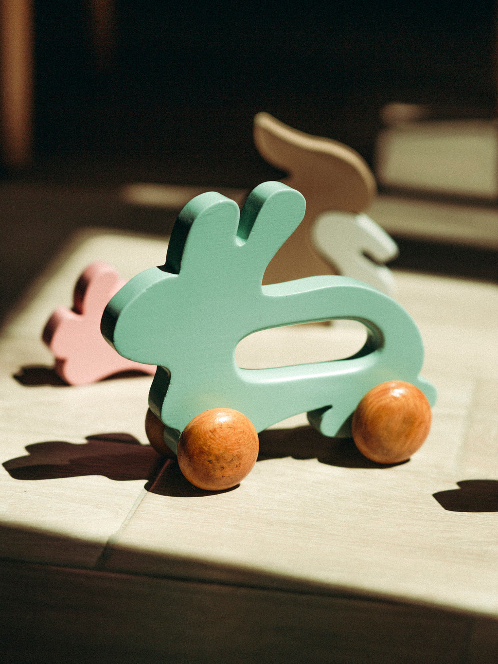 Wooden Bunny Push Toy On Wheels Green