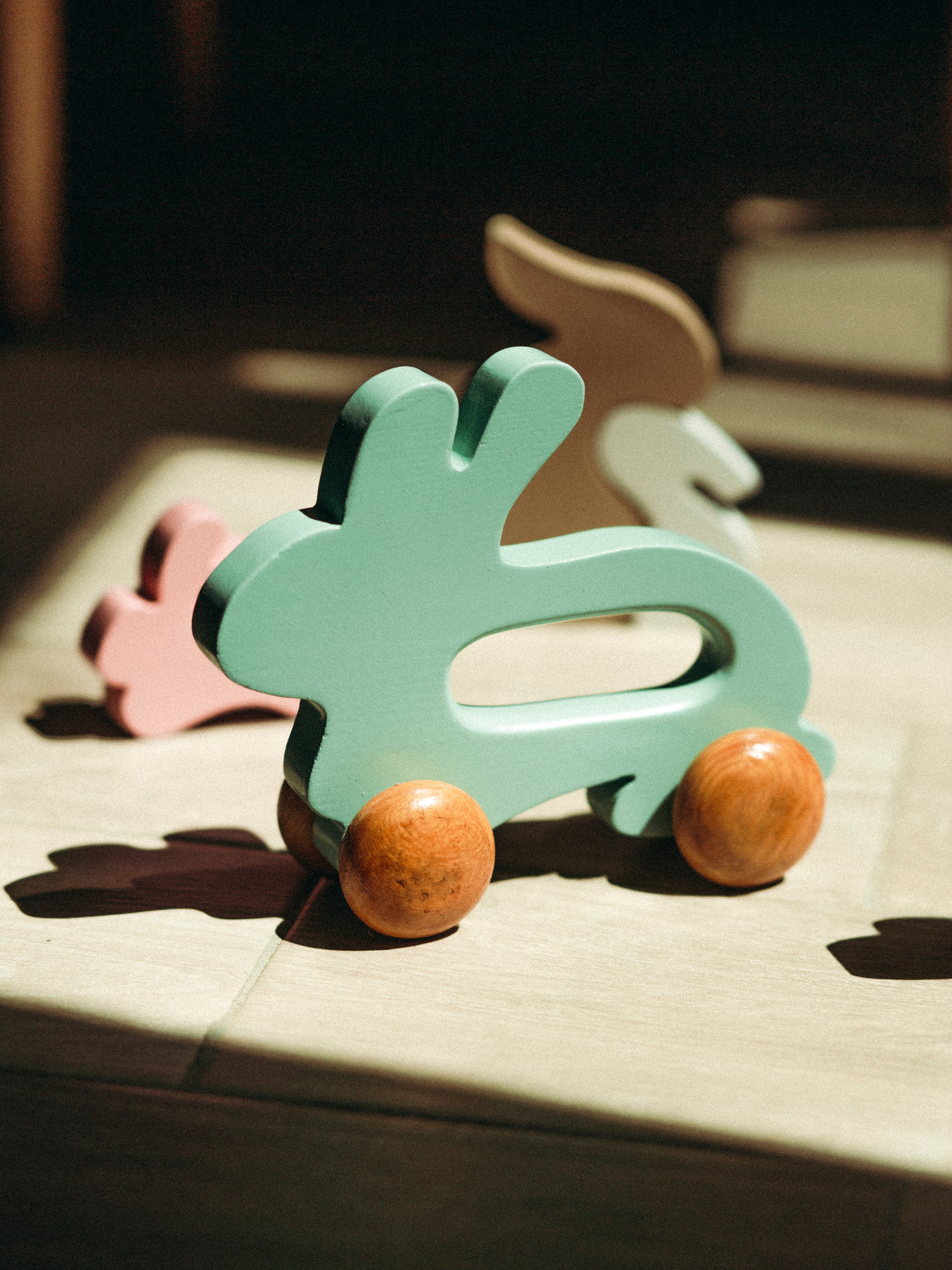 Wooden Bunny Push Toy On Wheels Green
