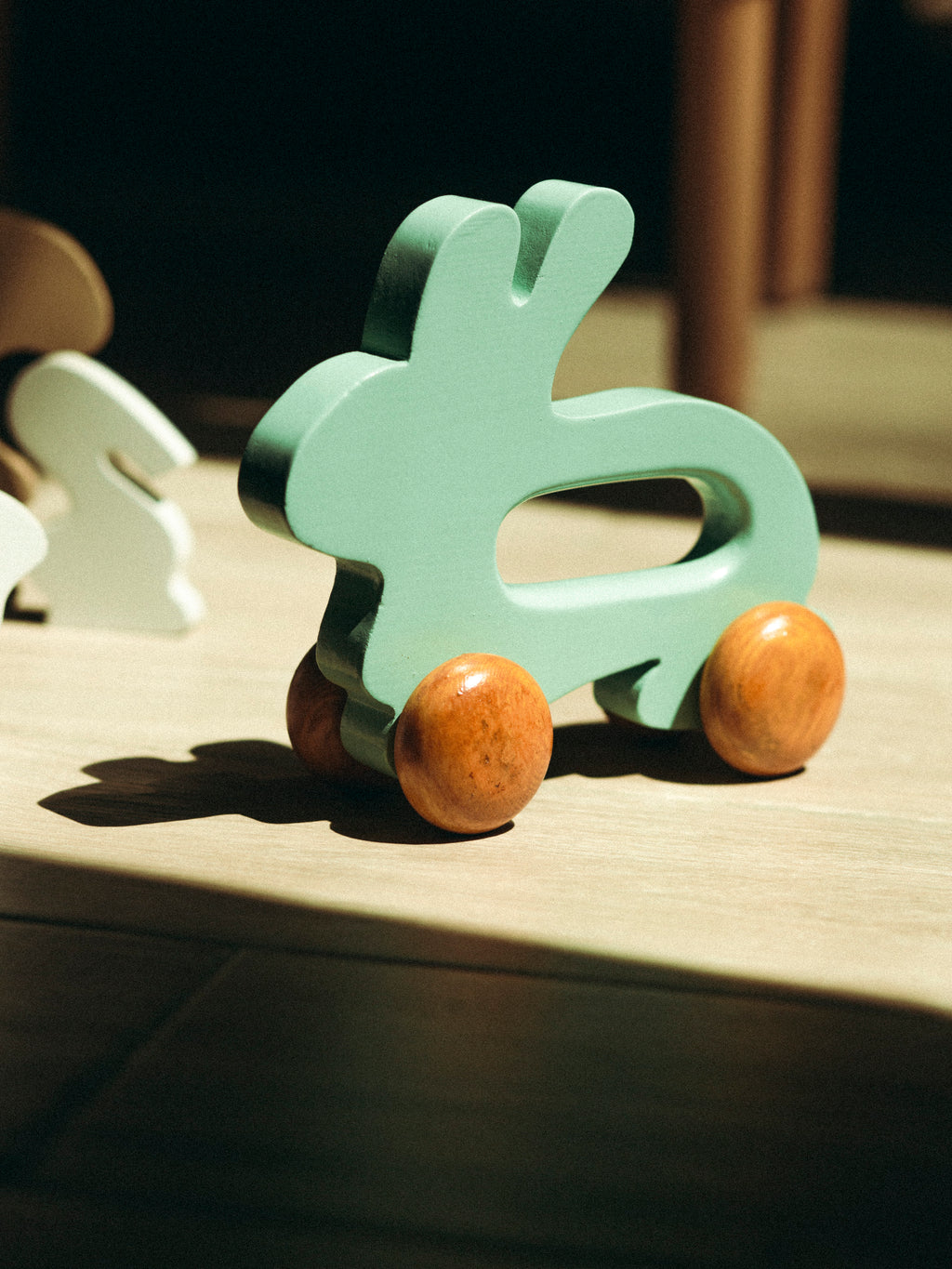 Wooden Bunny Push Toy On Wheels Green