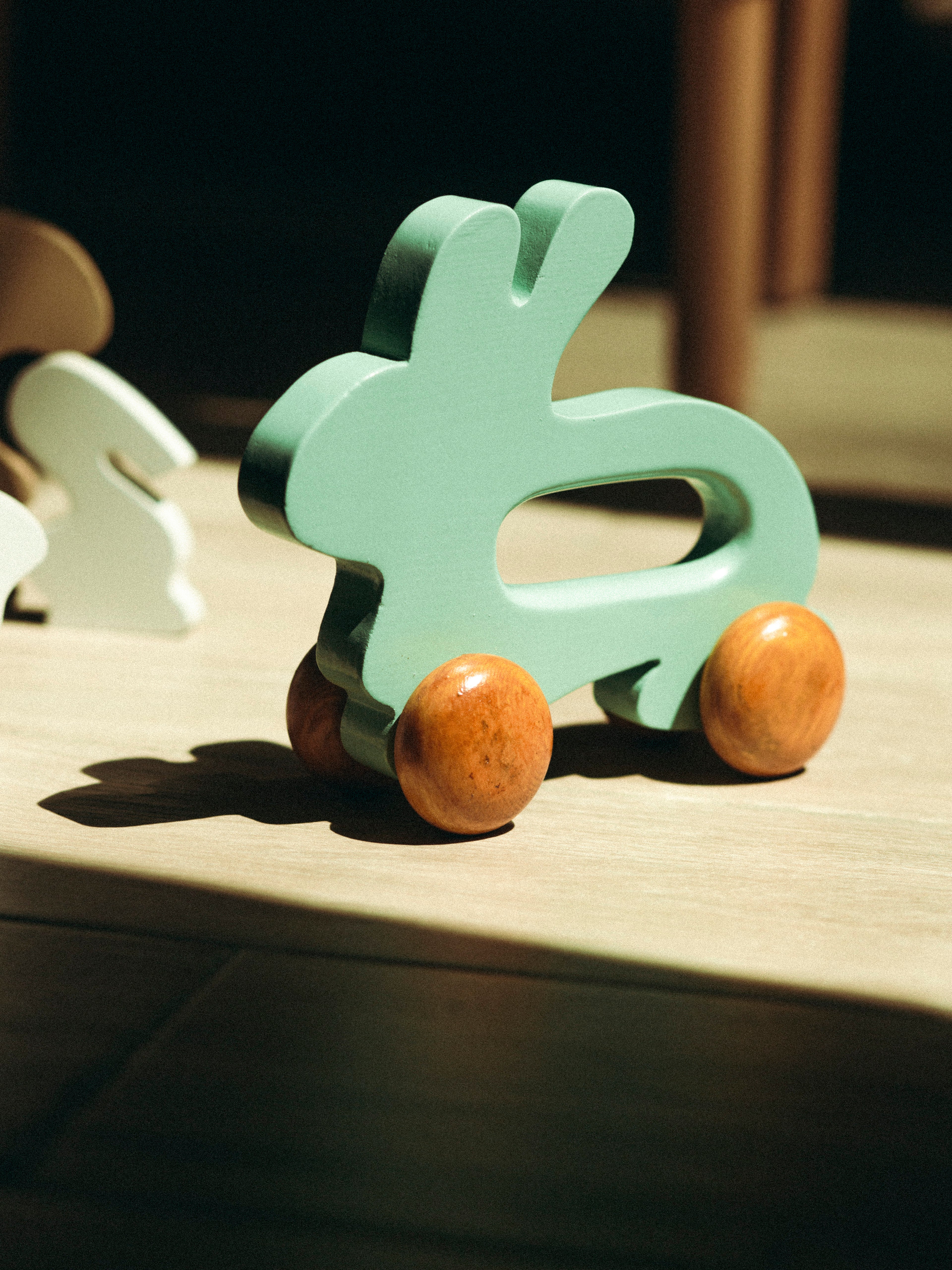 Wooden Bunny Push Toy On Wheels Green